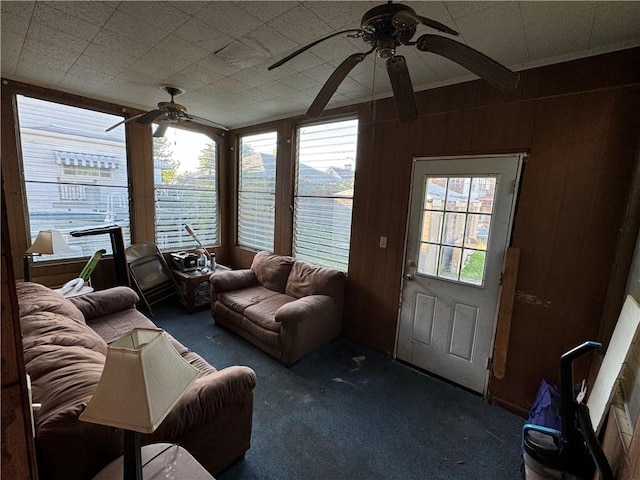 1413 Summit Ave, Monessen, PA 15062 - living room with ceiling fan, carpet, and wooden walls