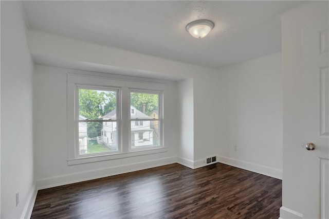 1311 Irwin St, Aliquippa, PA 15001 - spare room featuring dark wood-style floors and baseboards