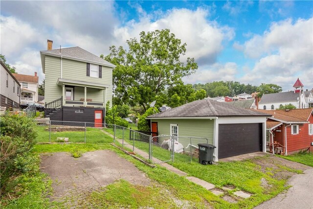 103 Lackawana Ave, Bentleyville, PA 15314 - rear view of property featuring a gate and a garage