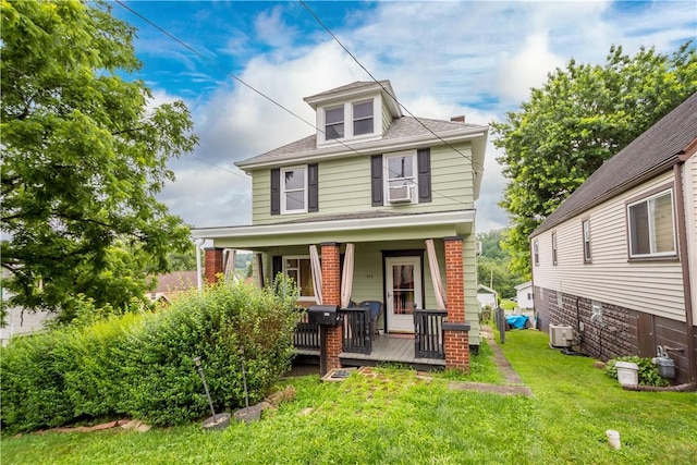 103 Lackawana Ave, Bentleyville, PA 15314 - traditional style home with covered porch, a front lawn, cooling unit, and a shingled roof