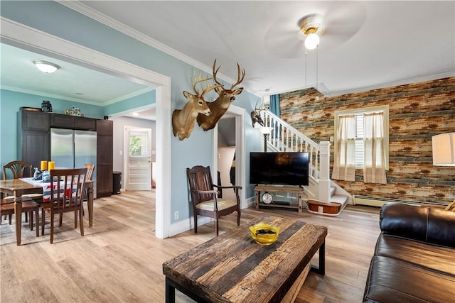 103 Lackawana Ave, Bentleyville, PA 15314 - living area featuring stairway, crown molding, ceiling fan, a baseboard heating unit, and light wood-style flooring