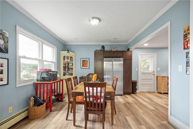 103 Lackawana Ave, Bentleyville, PA 15314 - dining area with baseboard heating, light wood-type flooring, and crown molding