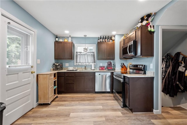 103 Lackawana Ave, Bentleyville, PA 15314 - kitchen featuring appliances with stainless steel finishes, light countertops, light wood-style floors, recessed lighting, and dark brown cabinets