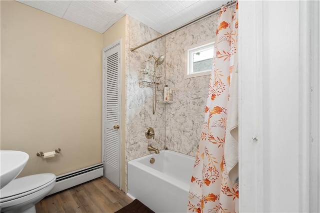 103 Lackawana Ave, Bentleyville, PA 15314 - bathroom featuring baseboard heating, shower / bath combo with shower curtain, and wood finished floors
