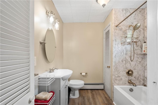 103 Lackawana Ave, Bentleyville, PA 15314 - bathroom with a baseboard radiator, vanity, shower / bath combination, and wood finished floors