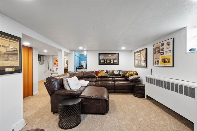 103 Lackawana Ave, Bentleyville, PA 15314 - living area with radiator heating unit, carpet floors, and recessed lighting