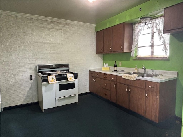 202 Hoeveler St, Springdale Boro, PA 15144 - kitchen featuring range with two ovens, light countertops, crown molding, and brick wall