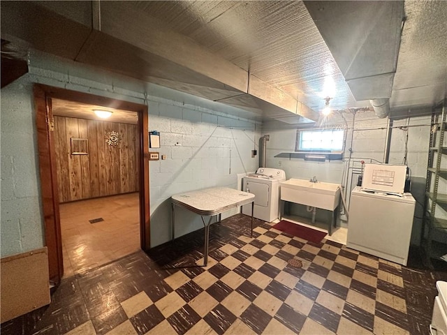 202 Hoeveler St, Springdale Boro, PA 15144 - basement featuring washer and clothes dryer, tile patterned floors, and concrete block wall