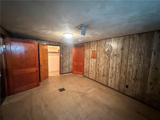202 Hoeveler St, Springdale Boro, PA 15144 - unfurnished bedroom featuring wood walls