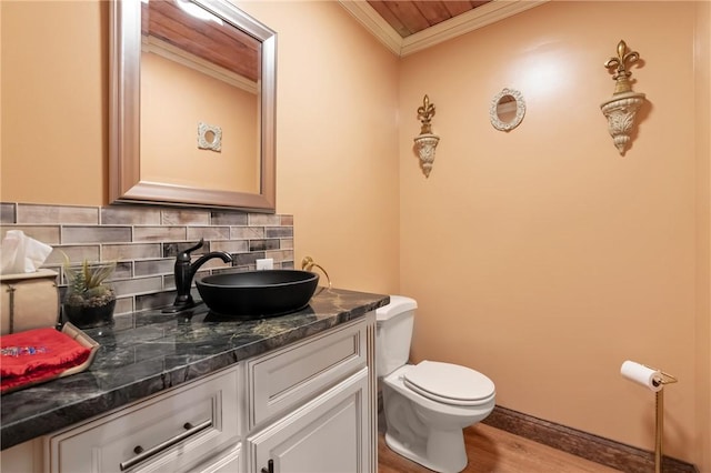 204 S Links Ave, Twp Of But Nw, PA 16001 - half bath with crown molding, wood finished floors, vanity, and tasteful backsplash