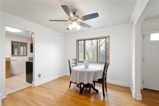 708 Washington St, Bentleyville, PA 15314 - dining area with a ceiling fan, light wood finished floors, and ornamental molding