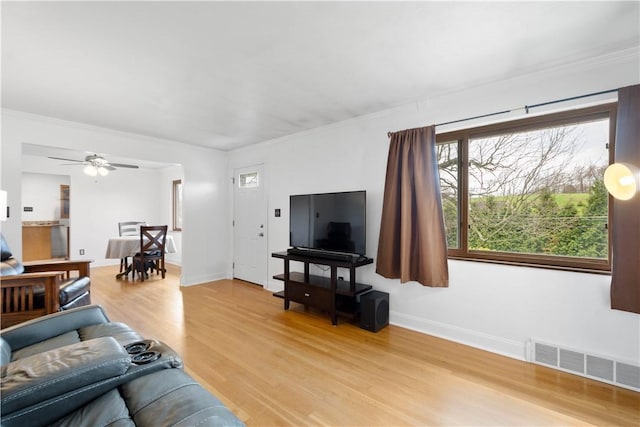 708 Washington St, Bentleyville, PA 15314 - living room featuring light wood-style flooring, crown molding, and a ceiling fan