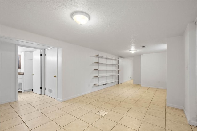 708 Washington St, Bentleyville, PA 15314 - empty room featuring a textured ceiling and light tile patterned floors