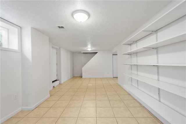 708 Washington St, Bentleyville, PA 15314 - finished below grade area featuring a textured ceiling and light tile patterned flooring