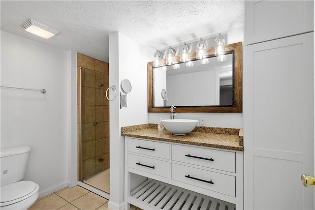 708 Washington St, Bentleyville, PA 15314 - full bathroom with vanity, tile patterned flooring, tiled shower, and a textured ceiling