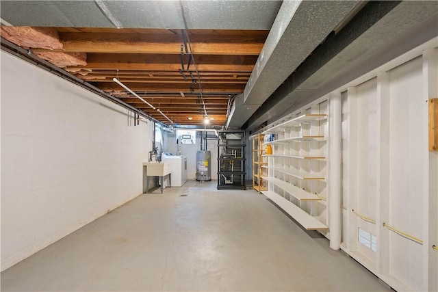 708 Washington St, Bentleyville, PA 15314 - basement featuring water heater and washer and dryer