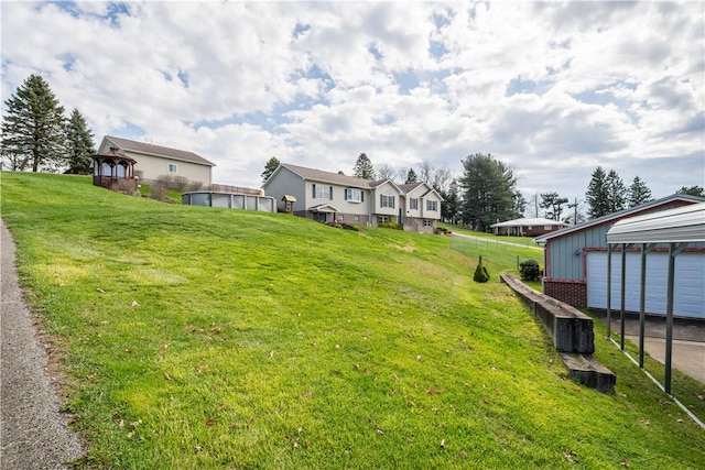 708 Washington St, Bentleyville, PA 15314 - view of grassy yard featuring a gazebo, an outbuilding, and a residential view