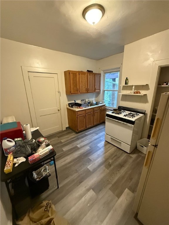 2306 Sherbrook St, Squirrel Hill, PA 15217 - kitchen with white appliances, brown cabinets, dark wood-style floors, and light countertops