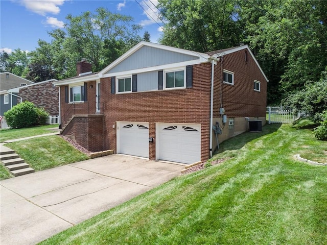249 Laurie Dr, Penn Hills, PA 15235 - ranch-style home with an attached garage, brick siding, concrete driveway, and a chimney