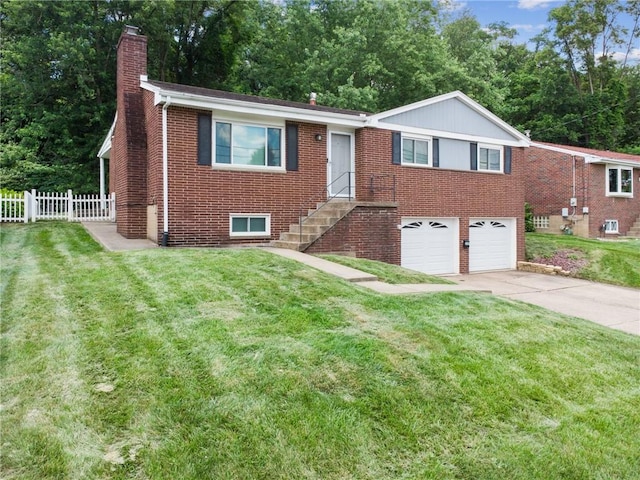 249 Laurie Dr, Penn Hills, PA 15235 - single story home with a chimney, concrete driveway, a garage, and brick siding
