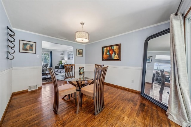 249 Laurie Dr, Penn Hills, PA 15235 - dining room featuring wood finished floors and crown molding