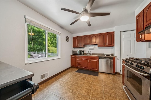249 Laurie Dr, Penn Hills, PA 15235 - kitchen featuring appliances with stainless steel finishes, a ceiling fan, and tile patterned flooring