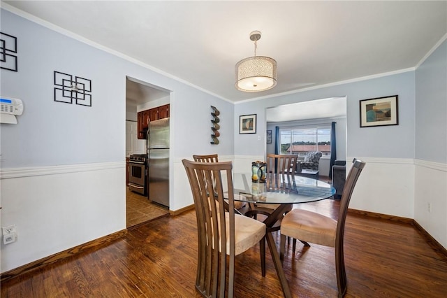249 Laurie Dr, Penn Hills, PA 15235 - dining space featuring dark wood-type flooring and ornamental molding