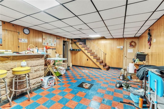 200 Champa St, Penn Hills, PA 15235 - finished below grade area with tile patterned floors, wooden walls, stairs, and a paneled ceiling