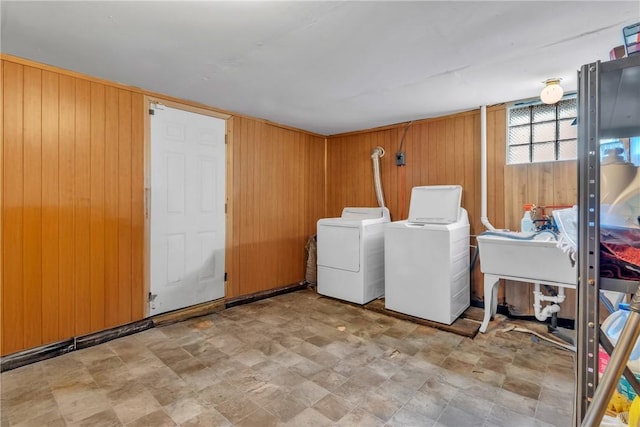 200 Champa St, Penn Hills, PA 15235 - laundry room with washer and clothes dryer, wooden walls, and stone finish floors