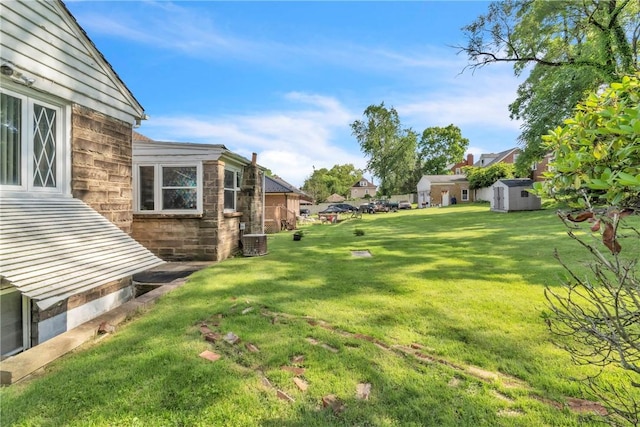 200 Champa St, Penn Hills, PA 15235 - view of grassy yard with a storage unit