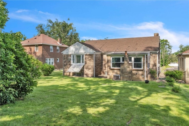 200 Champa St, Penn Hills, PA 15235 - back of house with a lawn, a chimney, and brick siding