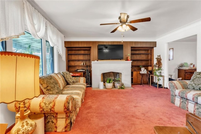 200 Champa St, Penn Hills, PA 15235 - living room with a ceiling fan, crown molding, carpet floors, a fireplace with flush hearth, and built in shelves