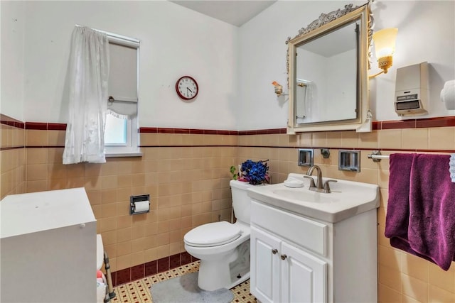 200 Champa St, Penn Hills, PA 15235 - bathroom with tile walls, vanity, and a wainscoted wall