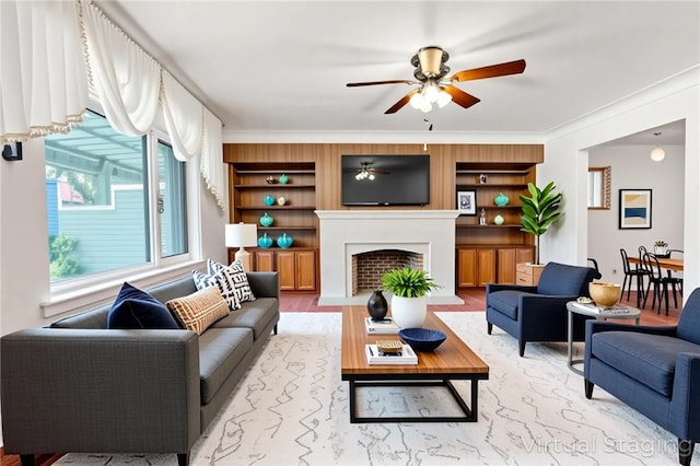 200 Champa St, Penn Hills, PA 15235 - living area with a ceiling fan, a fireplace with flush hearth, built in shelves, and crown molding