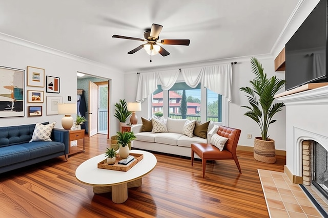 200 Champa St, Penn Hills, PA 15235 - living room with a fireplace with flush hearth, light wood-style floors, crown molding, and a ceiling fan