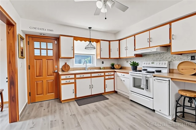 200 Champa St, Penn Hills, PA 15235 - kitchen with white electric range, exhaust hood, light countertops, and white cabinetry