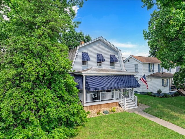 488 Buffalo St, Beaver, PA 15009 - colonial inspired home featuring a gambrel roof, a front yard, and a chimney