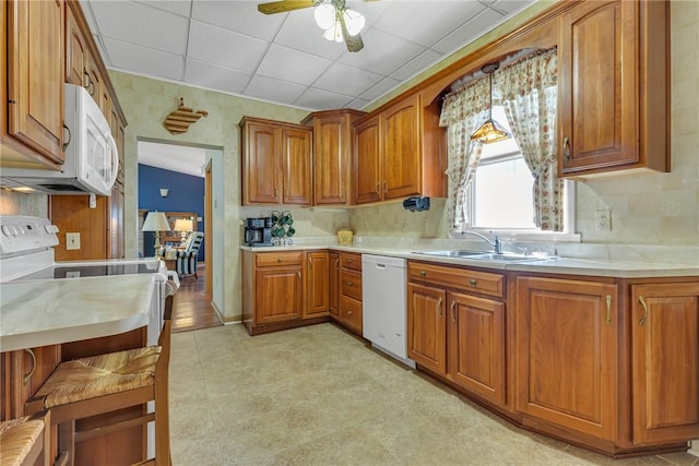 488 Buffalo St, Beaver, PA 15009 - kitchen featuring white appliances, light countertops, brown cabinets, ceiling fan, and light flooring
