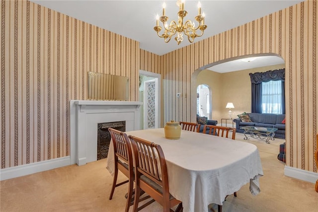 488 Buffalo St, Beaver, PA 15009 - carpeted dining area featuring arched walkways, a fireplace, a chandelier, and wallpapered walls