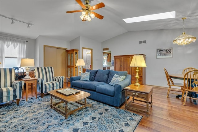 488 Buffalo St, Beaver, PA 15009 - living room with a skylight, rail lighting, wood finished floors, ceiling fan, and vaulted ceiling