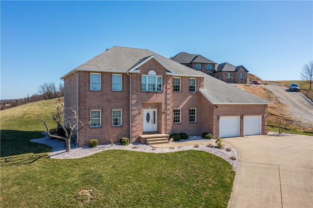 138 Crossridge Rd, Fallowfield, PA 15022 - view of front of house featuring an attached garage, concrete driveway, a front lawn, and brick siding