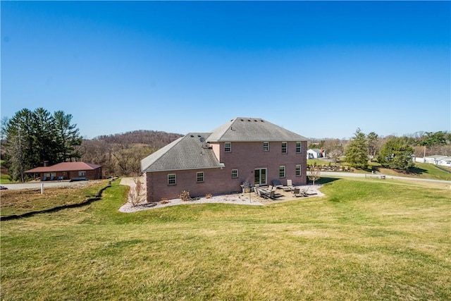138 Crossridge Rd, Fallowfield, PA 15022 - back of house featuring a patio area and a lawn