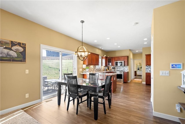 138 Crossridge Rd, Fallowfield, PA 15022 - dining room with wood finished floors, a chandelier, and recessed lighting