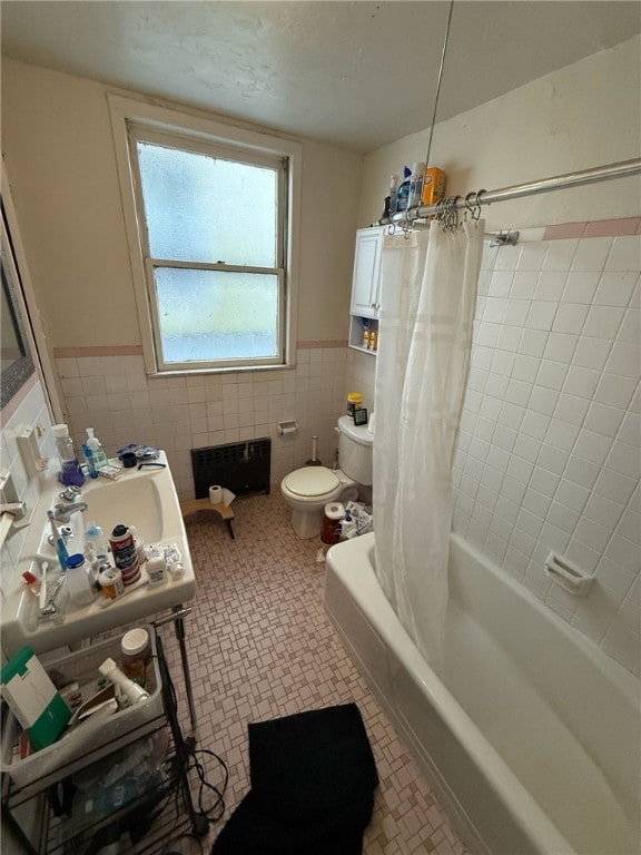 5837 Nicholson St, Squirrel Hill, PA 15217 - bathroom featuring tile walls, radiator heating unit, a wainscoted wall, and shower / bath combo with shower curtain