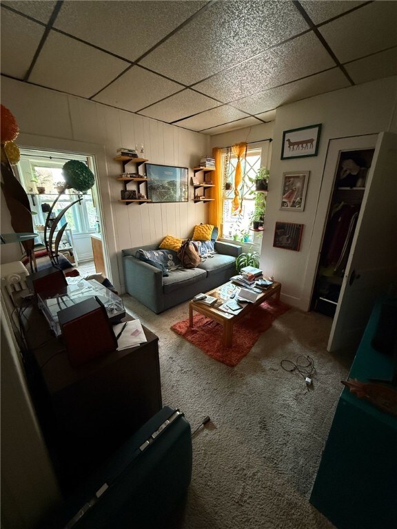 5837 Nicholson St, Squirrel Hill, PA 15217 - living area with a drop ceiling and carpet flooring
