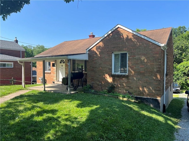 920 Jefferson Rd, Penn Hills, PA 15235 - view of front facade featuring a patio, brick siding, and a chimney