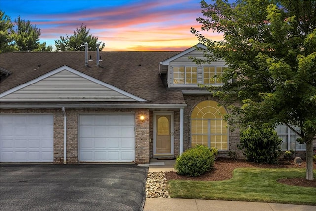 302 Malcolm Ct, Monroeville, PA 15146 - traditional home featuring a garage, asphalt driveway, roof with shingles, and brick siding