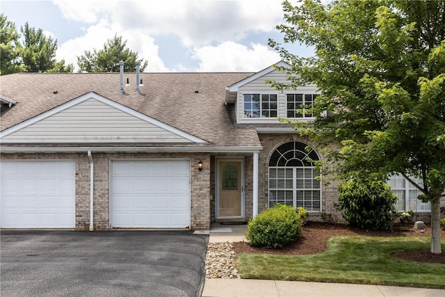 302 Malcolm Ct, Monroeville, PA 15146 - view of front of home featuring an attached garage, a shingled roof, asphalt driveway, and brick siding
