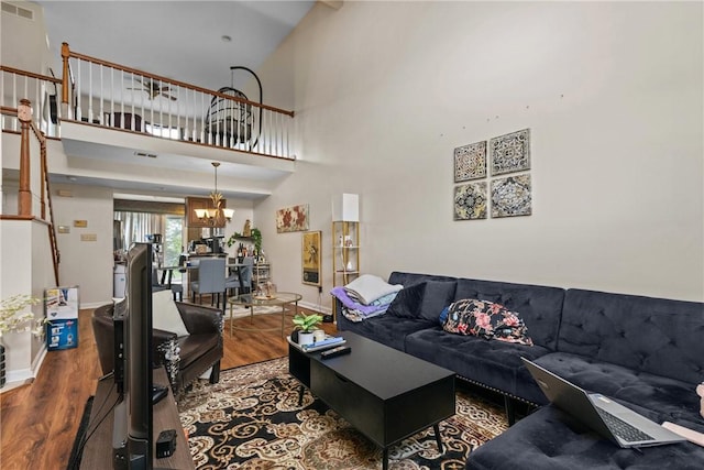 302 Malcolm Ct, Monroeville, PA 15146 - living area featuring wood finished floors, a chandelier, and a towering ceiling