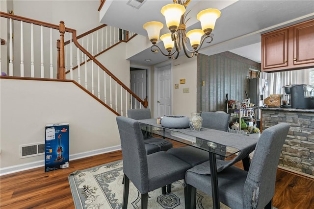 302 Malcolm Ct, Monroeville, PA 15146 - dining space featuring a chandelier, wood finished floors, and stairway